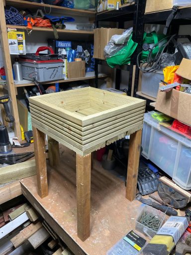 Wooden square planter with wooden legs for planets. Tall legs for thigh height.